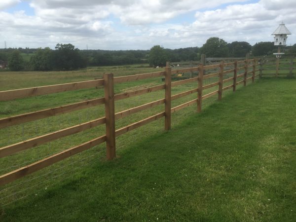 Wooden post and rail fencing perfect for commercial purposes.