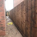 Wooden garden fencing beside a new build house in Birmingham.