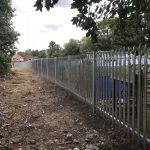 Steel security commercial fencing alongside a walkway in Birmingham.