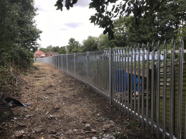 Steel security commercial fencing alongside a walkway in Birmingham.