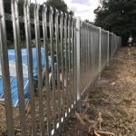 Steel commercial fencing alongside a public walkway in Birmingham.