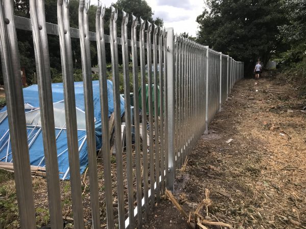 Steel commercial fencing alongside a public walkway in Birmingham.