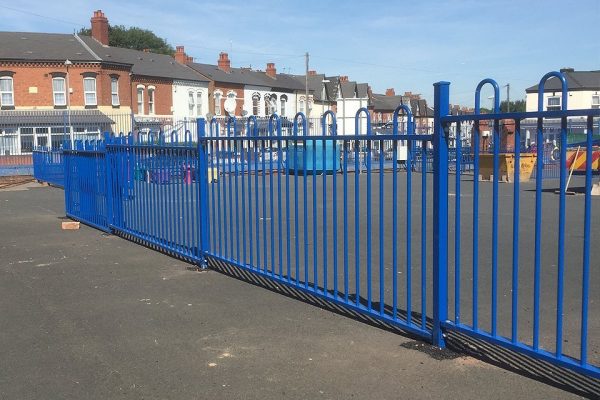 Blue commercial railings surrounding a yard in Birmingham.