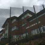 Green double mesh fencing. These commercial fences are used secure office buildings in Birmingham.