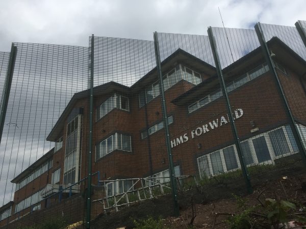 Green double mesh fencing. These commercial fences are used secure office buildings in Birmingham.