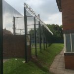 Double wire mesh fence panel with security spikes. This commercial fencing is perfect for securing industrial areas / prisons.