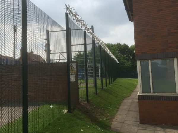 Double wire mesh fence panel with security spikes. This commercial fencing is perfect for securing industrial areas / prisons.
