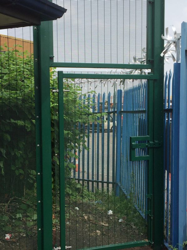 Green double wire mesh gates. These commercial gates are used to keep vehicles secured.