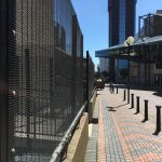 Double mesh fencing in black. This commercial fencing provides security for a area in Birmingham city centre.