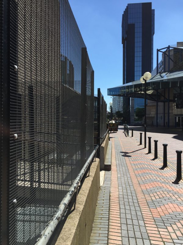 Double mesh fencing in black. This commercial fencing provides security for a area in Birmingham city centre.