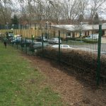 Double mesh fencing being assembled around a car park in Birmingham. Commercial fences offer a great security solution.
