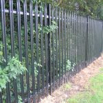 Back steel palisade fencing. Commercial fencing provides a quality security solution.