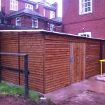 Commercial shed in a outside space. The commercial shed is used as a simple storage solution.