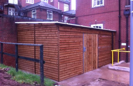 Commercial shed in a outside space. The commercial shed is used as a simple storage solution.