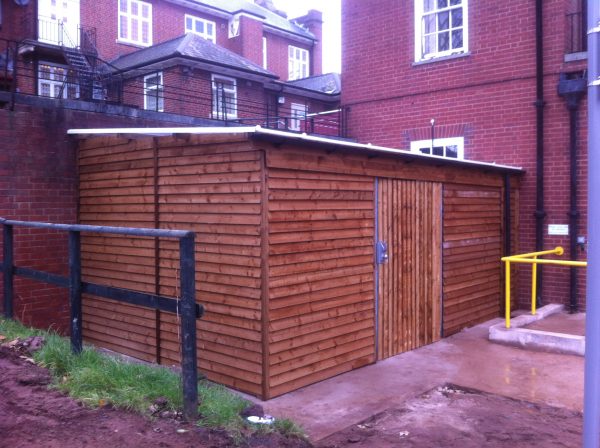 Commercial shed in a outside space. The commercial shed is used as a simple storage solution.