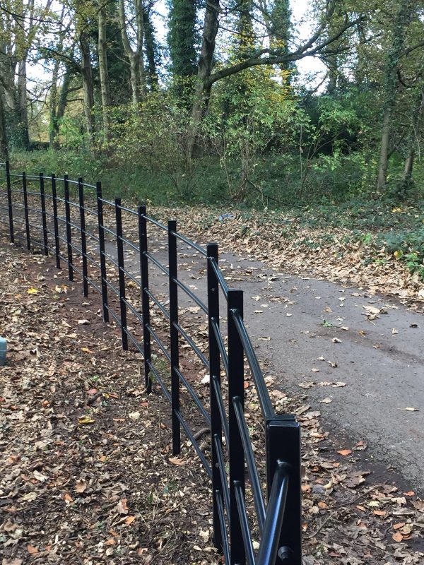 Black bespoke railings. The bespoke railings provide security for private areas.