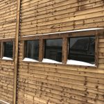 A commercial shed with five glass windows.