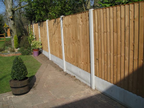 A garden on Birmingham with a long fence. The fence has close board fence panels.