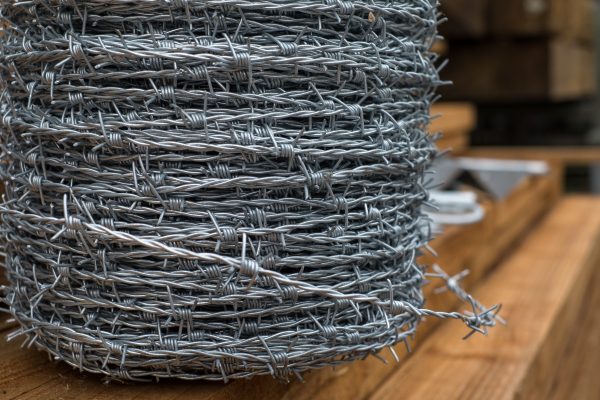 A large roll of barbed wire. This barbed wire can be used to secure commercial and domestic properties.