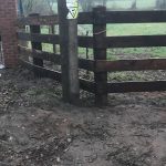 Pressure treated timber rail fence.