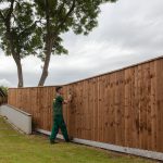 Hodges & Lawrence staff assembling a fence with feather edge boards.