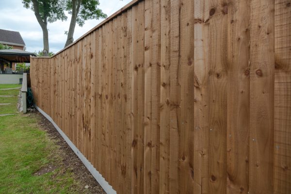 A wooden fence in Birmingham. The fence had feather edge boards.