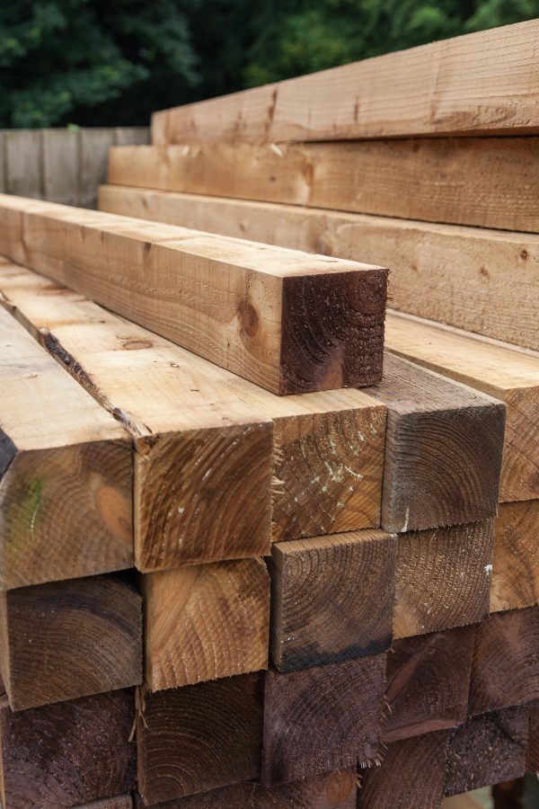 Pressure treated timber. The wood is light in colour and is on display on a fencing suppliers in Birmingham.