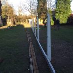 Hodges & Lawrence staff erecting concrete fence posts.