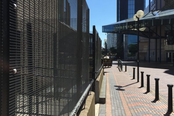 Black steel commercial fencing surrounding an area in Birmingham city centre.