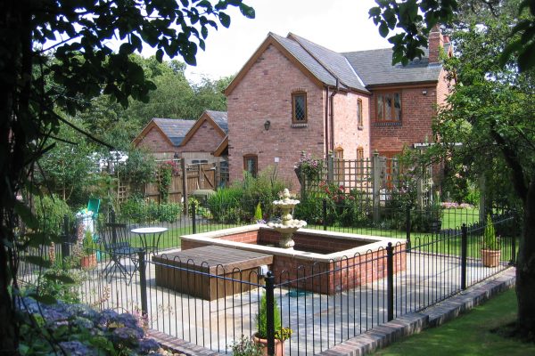 Black bespoke railings used in a garden in Birmingham.