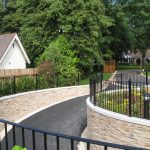 A driveway in Birmingham with bespoke commercial fencing on either side.